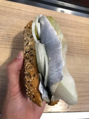 herring fillet in bread with onion